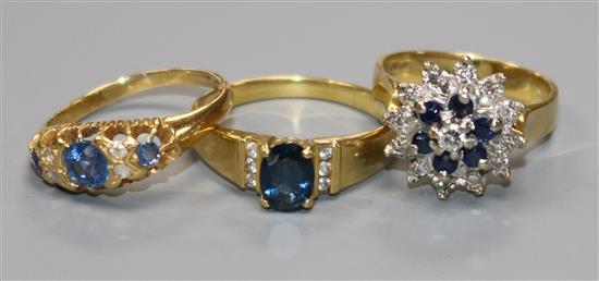 Three assorted 18ct gold, sapphire and diamond set dress rings.